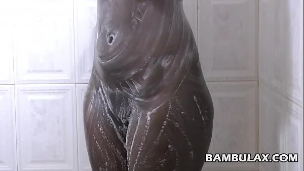 Natural ebony boops taking shower