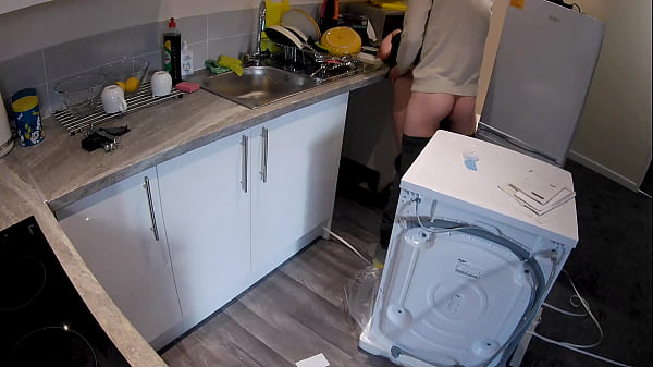 Horny wife seduces a plumber in the kitchen while her husband at work.